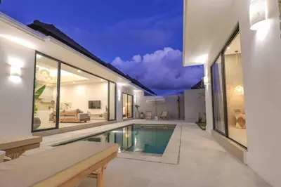 a swimming pool in the middle of a house at Villa Isea-3 bedroom with pool in Seminyak