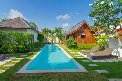a swimming pool in the backyard of a villa at Milavila in Seminyak