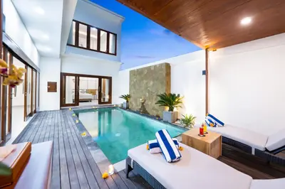 a swimming pool in a villa with a bedroom at Villa Marili Seminyak by Nagisa Bali in Seminyak