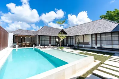 a swimming pool in the backyard of a house at Green Jimbaran Bay Villa II in Jimbaran