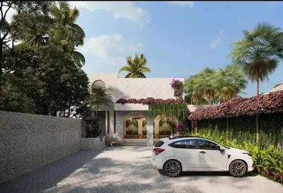 a white car parked in front of a house at Green Jimbaran Bay Villa II in Jimbaran