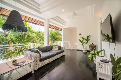 a living room with a couch and a table at W villa in Seminyak
