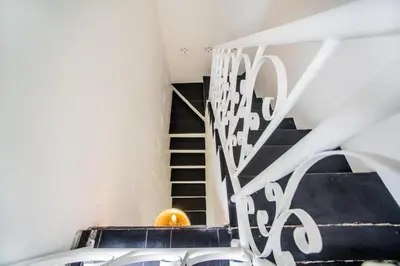 a spiral staircase with an orange in a room at W villa in Seminyak