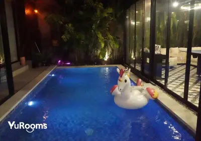 a swimming pool with a toy duck in the water at YuRooms Villapartment - Love Room Bali in Jimbaran
