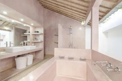 a large bathroom with a tub and a sink at Luxurious&Spacious 4Br Villa in Seminyak in Seminyak