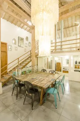 a large dining room with a wooden table and chairs at Luxurious&Spacious 4Br Villa in Seminyak in Seminyak