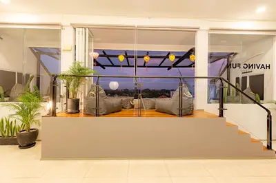 a living room with a view of the city at Beautiful Penthouse w/ incredible views, pool, & cinema room! in Canggu