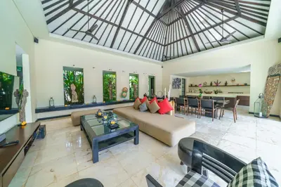 a large living room with a couch and a table at Exquisite 4BD Luxury Villa in the Heart of Berawa in Canggu