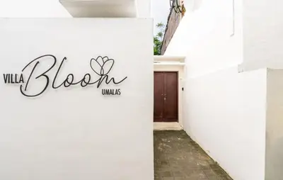 a white wall with a sign that reads black walls at Bloom Umalas Villa by Betterplace in Canggu