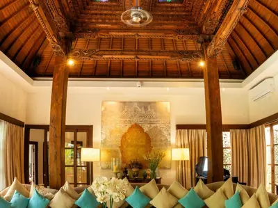 a living room with a bunch of pillows on a couch at LataLiana Seminyak in Seminyak