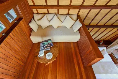 an overhead view of a couch in a room with a table at LataLiana Seminyak in Seminyak