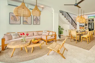 a living room with a couch and a table at Villa San Diego: Brand New 4BDR in Seminyak