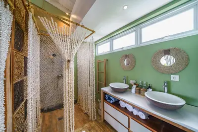 a bathroom with a shower and a sink at Private Penthouse with Sunset Views Central Seminyak in Seminyak