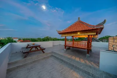 a gazebo on the roof of a house at TC Villa Taman Mumbul Nusa Dua in Nusa Dua