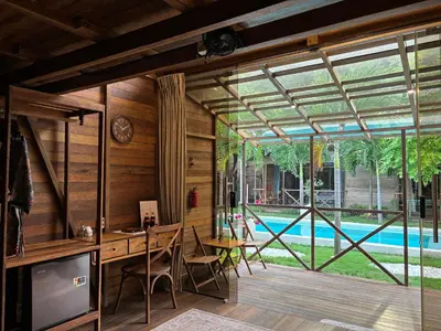 an internal view of a house with a pool at Bali Cozy Bungalows, Nusa Dua Benoa in Nusa Dua