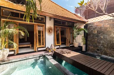 a villa with a swimming pool and a house at PROMO DEAL Sweet Unique Hidden Gem 2 BD Villa - CONSTRUCTION NEARBY in Kerobokan