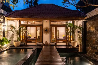 a villa with a swimming pool at night at PROMO DEAL Sweet Unique Hidden Gem 2 BD Villa - CONSTRUCTION NEARBY in Kerobokan