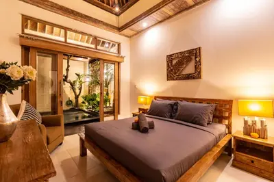 a bedroom with a bed with a teddy bear on it at PROMO DEAL Sweet Unique Hidden Gem 2 BD Villa - CONSTRUCTION NEARBY in Kerobokan