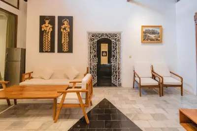 a living room with a couch and chairs and a table at 5 Bedroom Villa Etnik in Seminyak with Big Garden and Private Pool in Seminyak