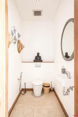 a bathroom with a toilet and a sink at New Brawah 5 BR Villa 200m to Finns Beach Club in Canggu