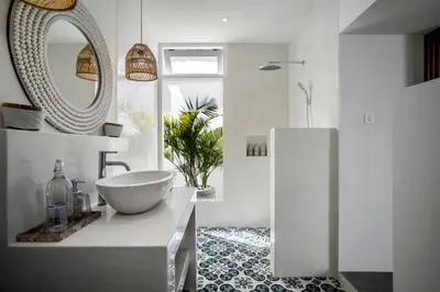 a bathroom with a bowl sink and a mirror at Villa Makena by Alfred in Bali in Seminyak