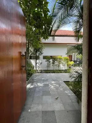 an entrance to a house with a walkway at Villa Plawa in Seminyak
