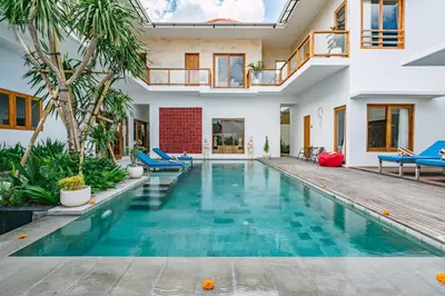 a swimming pool in a villa with a house at Villa Waldo - 6 bedroom High End Luxury Villa in Batu Belig, Seminyak in Canggu