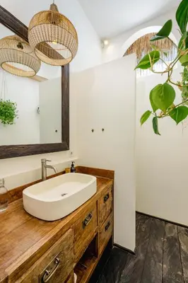 a bathroom with a sink and a mirror at Villa Micasa - Tropical Oasis 4BR Villa with Private Pool, Perfect for Big Groups, 12 Minutes to the Beach in Kerobokan