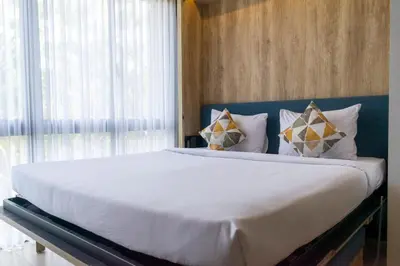 a bedroom with a large bed with white sheets and pillows at Anagata 3 Tanjung Benoa Bali in Nusa Dua