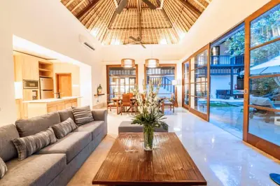 a living room with a couch and a table at Majestic 3 BR Private Pool Villa NE18 in Jimbaran
