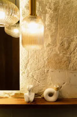 two white vases sitting on a shelf under a lamp at LUX Casa Amore 4BR pick up from airport security PlayStation and Netflix in Seminyak