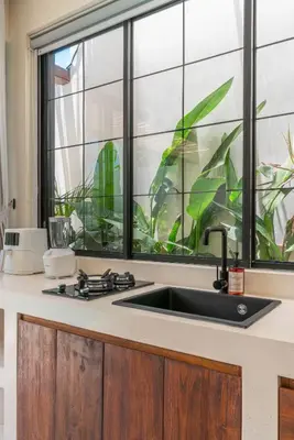 a kitchen with a sink and a window at Casa Melosa 1 - Romantic and Cozy 1BR Villa in the Heart of Umalas in Canggu