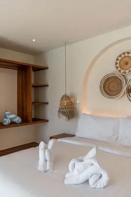 a bedroom with white towels on a bed at Casa Melosa 1 - Romantic and Cozy 1BR Villa in the Heart of Umalas in Canggu
