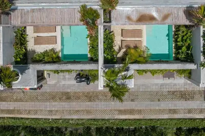 an overhead view of a building with palm trees at Casa Melosa 2 : Charming and Intimate 1BR Villa Nestled in Umalas in Canggu