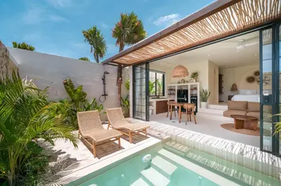 a villa with a pool and a bedroom at Casa Melosa 2 : Charming and Intimate 1BR Villa Nestled in Umalas in Canggu