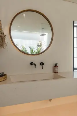 a bathroom sink with a mirror on the wall at Casa Melosa 2 : Charming and Intimate 1BR Villa Nestled in Umalas in Canggu