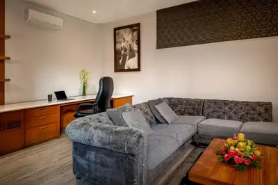 a living room with a couch and a table at Villa Eighty8 Private Residence with Gym & 20m Pool in Kerobokan