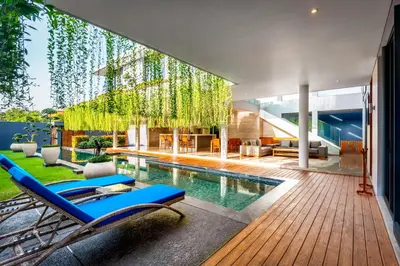 a house with a swimming pool and a patio at Villa Eighty8 Private Residence with Gym & 20m Pool in Kerobokan