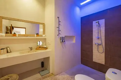 a bathroom with a shower and a sink and a toilet at 3 Bedroom cozy private pool Villa in Seminyak WIFI in Seminyak