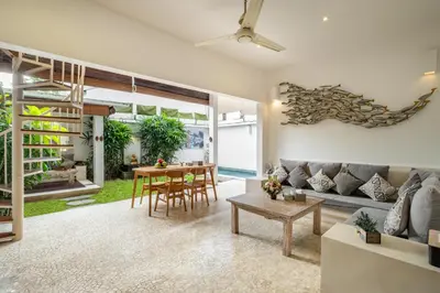 a living room with a couch and a table at 3 Bedroom cozy private pool Villa in Seminyak WIFI in Seminyak