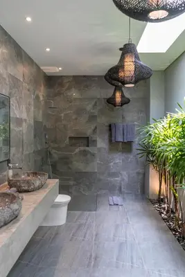 a bathroom with two sinks and a shower at Villa Koya : Luxurious and Modern 3BR Villa in Seminyak! in Seminyak