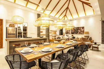 a large dining room with a long table and chairs at Spectacular 4BR Villa, 400m to Beachfront Bliss in Canggu