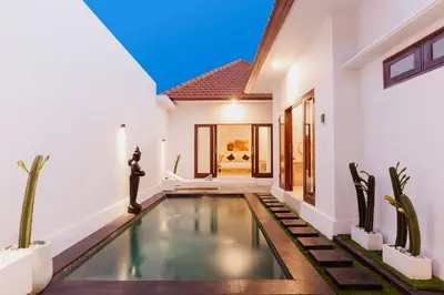 a swimming pool in the middle of a villa at Maisaba Seminyak Loft & Villas in Seminyak