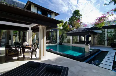 a swimming pool in the backyard of a villa at Villa One Seminyak in Seminyak