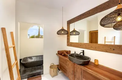 a bathroom with two sinks and a mirror at Villa Senya - Bali Bliss 3BR Mediterranean Escape with Private Pool, Stylish Retreat Between Seminyak & Canggu in Kerobokan