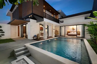 a swimming pool in the backyard of a house at Villa Ananya Seminyak by Nakula in Seminyak