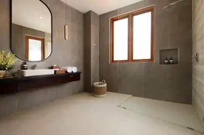a bathroom with a sink and a mirror at Villa Ananya Seminyak by Nakula in Seminyak