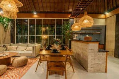 a living room with a table and a couch at Villa Nana by Pertama Management in Seminyak