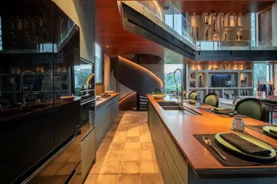 a large kitchen with a large island in the middle at Casa Madi Canggu in Canggu