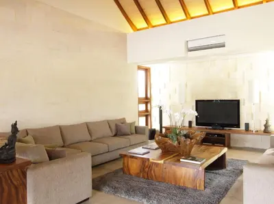 a living room with a couch and a coffee table at Dea Villas in Canggu